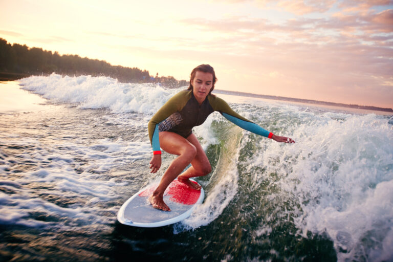 Projects woman surfboarding